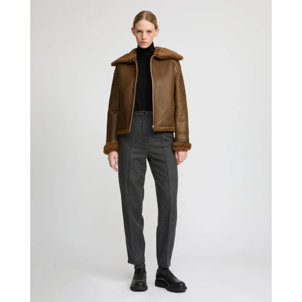 Woman wearing Yves Salomon shearling fur coat – luxury outerwear at Luxury Shoes 