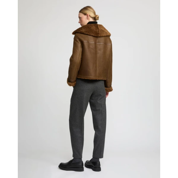 Woman wearing Yves Salomon shearling fur coat – luxury outerwear at Luxury Shoes 