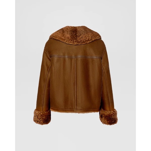 Woman wearing Yves Salomon shearling fur coat – luxury outerwear at Luxury Shoes 