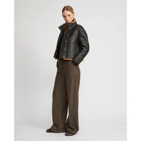Woman wearing Yves Salomon shearling fur coat – luxury outerwear at Luxury Shoes 