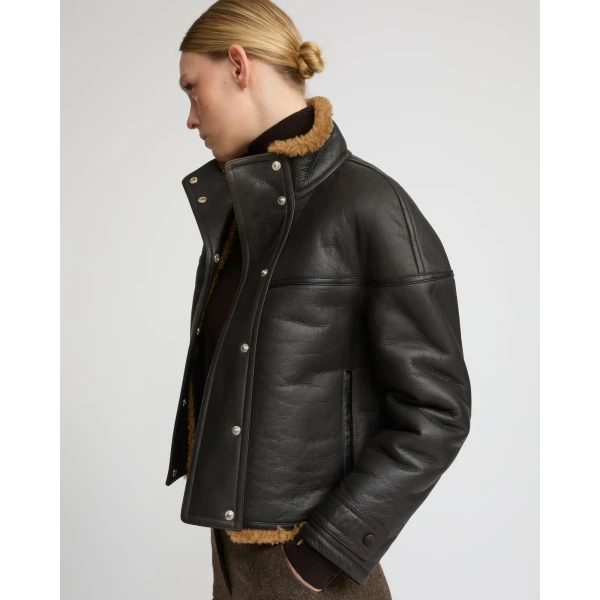 Woman wearing Yves Salomon shearling fur coat – luxury outerwear at Luxury Shoes 