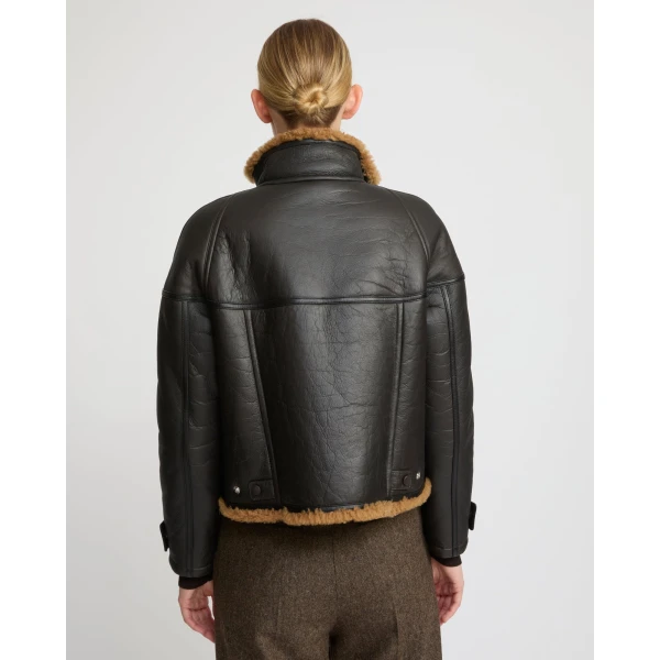Woman wearing Yves Salomon shearling fur coat – luxury outerwear at Luxury Shoes 