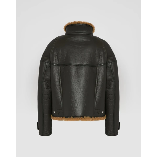 Woman wearing Yves Salomon shearling fur coat – luxury outerwear at Luxury Shoes 