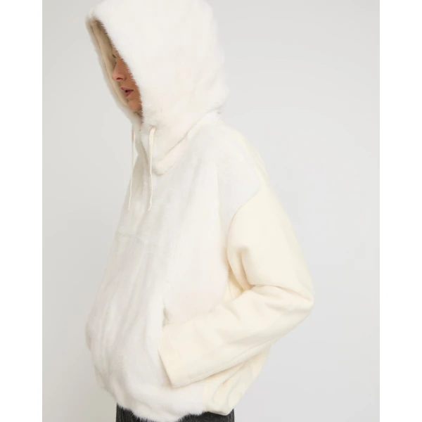 Woman wearing Yves Salomon shearling fur coat – luxury outerwear at Luxury Shoes 