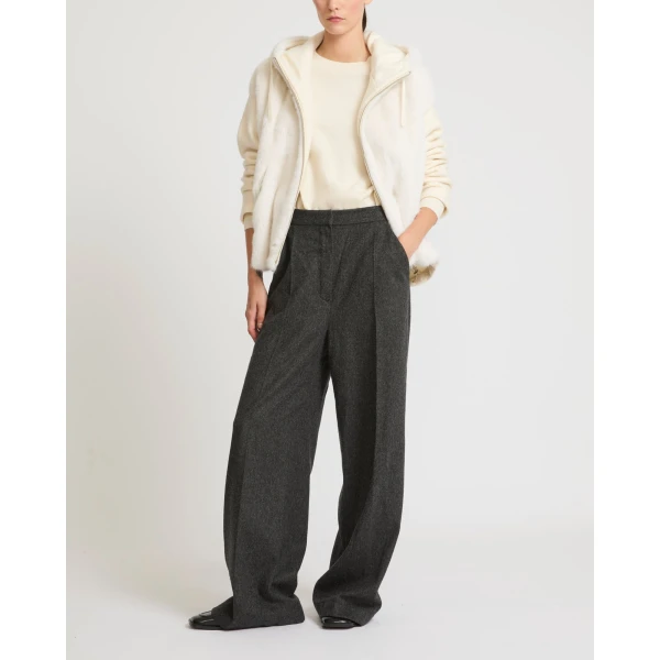 Woman wearing Yves Salomon shearling fur coat – luxury outerwear at Luxury Shoes 