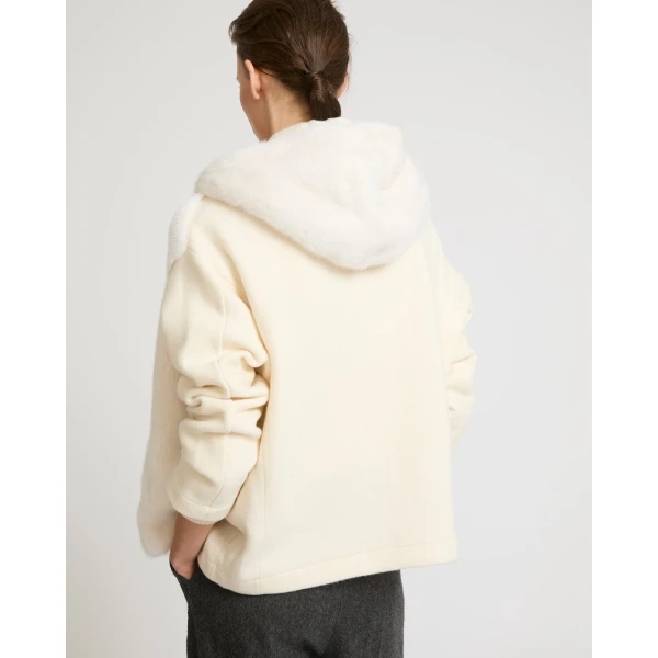 Woman wearing Yves Salomon shearling fur coat – luxury outerwear at Luxury Shoes 
