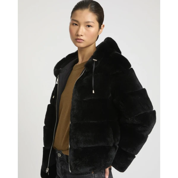 Woman wearing Yves Salomon shearling fur coat – luxury outerwear at Luxury Shoes 