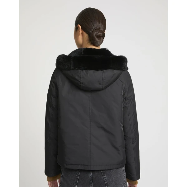 Woman wearing Yves Salomon shearling fur coat – luxury outerwear at Luxury Shoes 