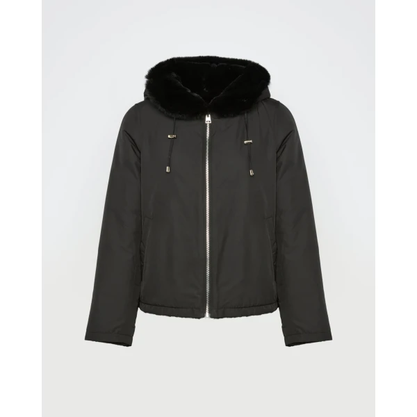 Woman wearing Yves Salomon shearling fur coat – luxury outerwear at Luxury Shoes 