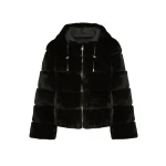 Woman wearing Yves Salomon shearling fur coat – luxury outerwear at Luxury Shoes 