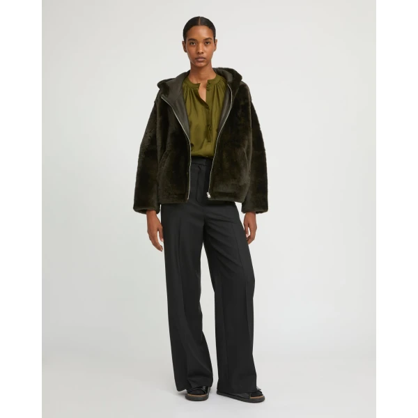 Woman wearing Yves Salomon shearling fur coat – luxury outerwear at Luxury Shoes 