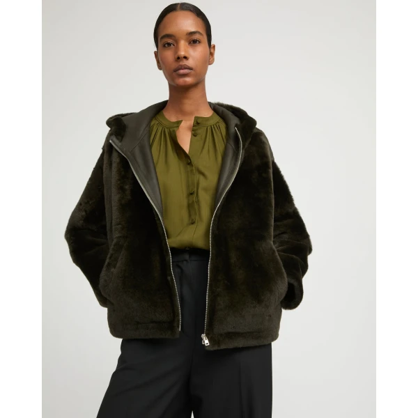 Woman wearing Yves Salomon shearling fur coat – luxury outerwear at Luxury Shoes 