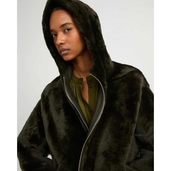Woman wearing Yves Salomon shearling fur coat – luxury outerwear at Luxury Shoes 
