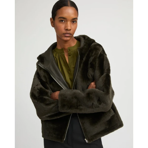 Woman wearing Yves Salomon shearling fur coat – luxury outerwear at Luxury Shoes 