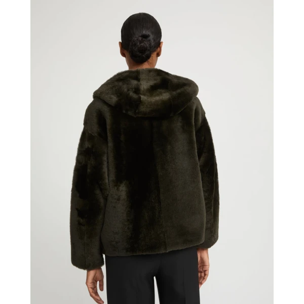 Woman wearing Yves Salomon shearling fur coat – luxury outerwear at Luxury Shoes 