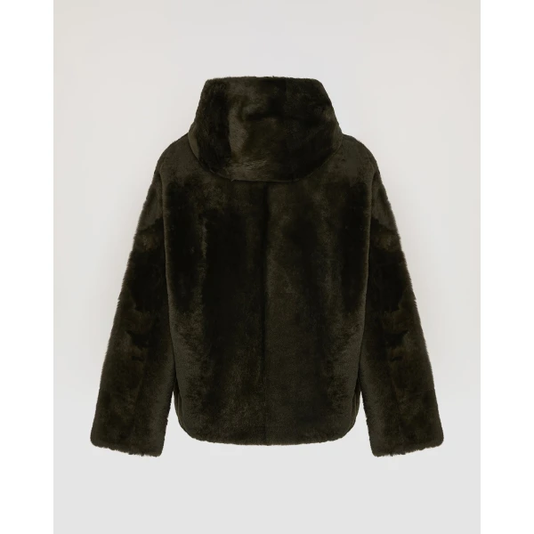 Woman wearing Yves Salomon shearling fur coat – luxury outerwear at Luxury Shoes 
