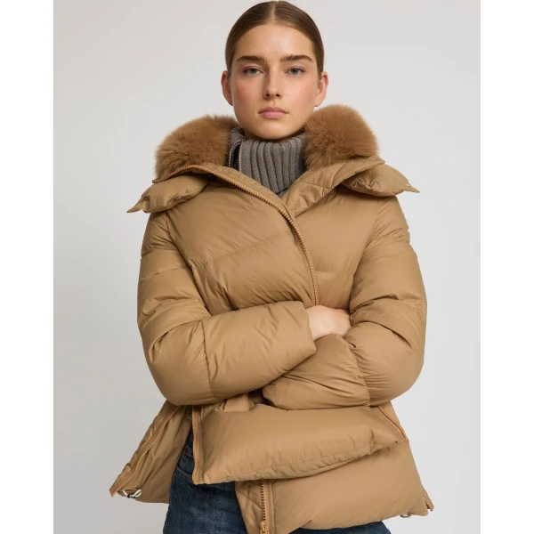 Woman wearing Yves Salomon shearling fur coat – luxury outerwear at Luxury Shoes 