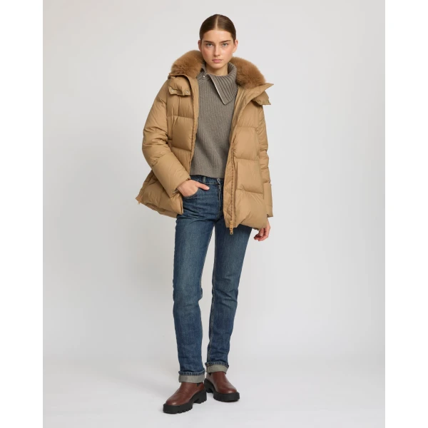 Woman wearing Yves Salomon shearling fur coat – luxury outerwear at Luxury Shoes 