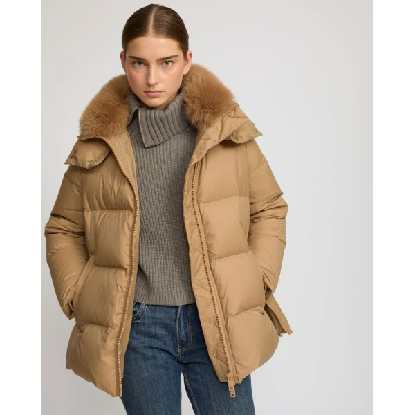 Woman wearing Yves Salomon shearling fur coat – luxury outerwear at Luxury Shoes 