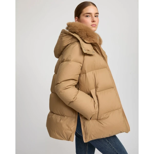 Woman wearing Yves Salomon shearling fur coat – luxury outerwear at Luxury Shoes 