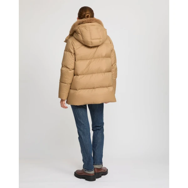 Woman wearing Yves Salomon shearling fur coat – luxury outerwear at Luxury Shoes 