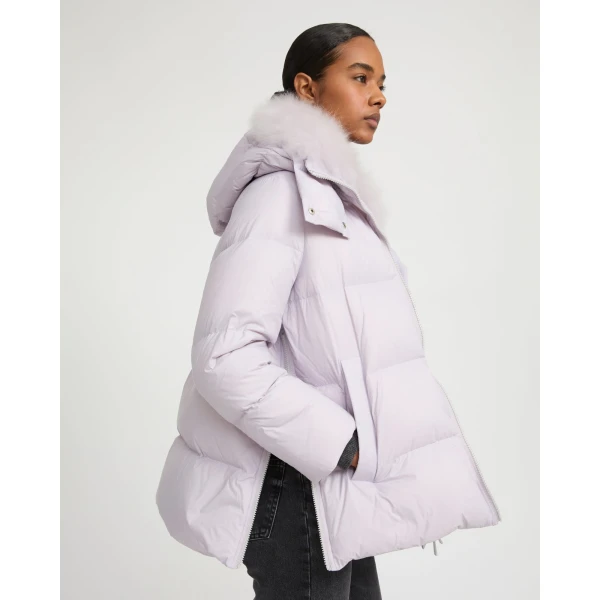Woman wearing Yves Salomon shearling fur coat – luxury outerwear at Luxury Shoes 