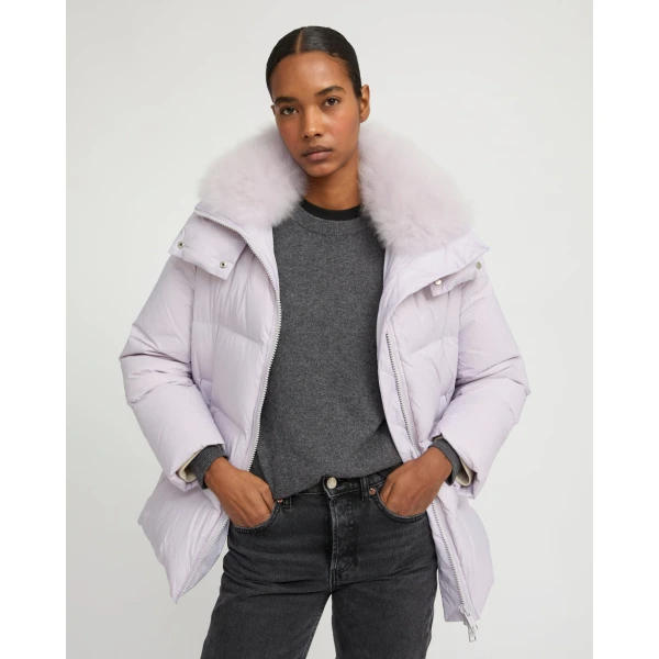 Woman wearing Yves Salomon shearling fur coat – luxury outerwear at Luxury Shoes 