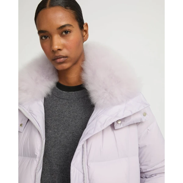 Woman wearing Yves Salomon shearling fur coat – luxury outerwear at Luxury Shoes 