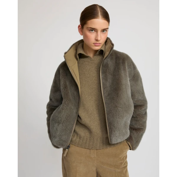 Woman wearing Yves Salomon shearling fur coat – luxury outerwear at Luxury Shoes 