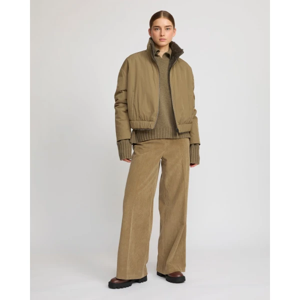 Woman wearing Yves Salomon shearling fur coat – luxury outerwear at Luxury Shoes 