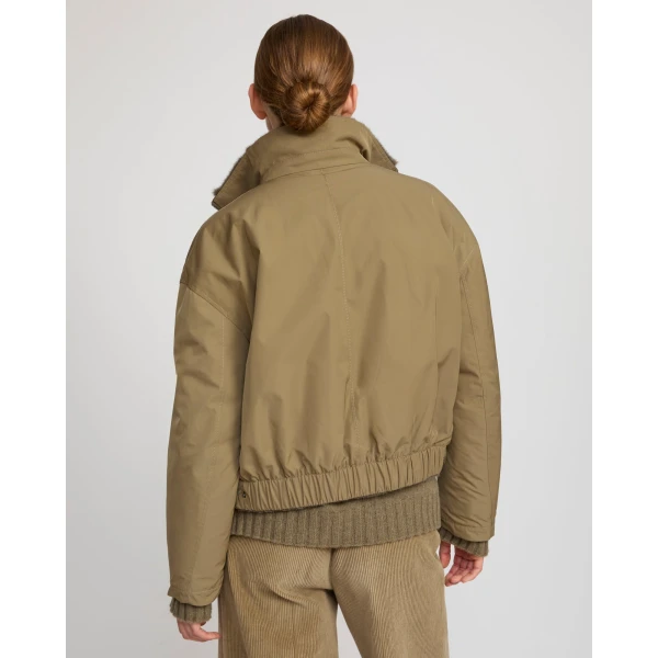 Woman wearing Yves Salomon shearling fur coat – luxury outerwear at Luxury Shoes 