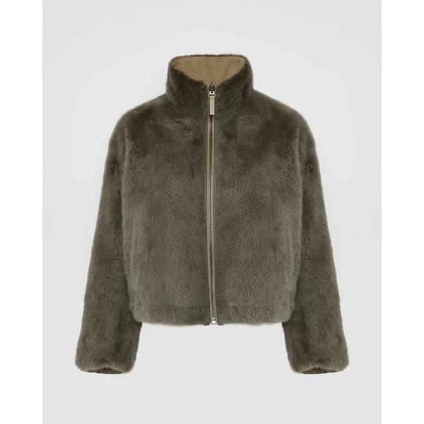 Woman wearing Yves Salomon shearling fur coat – luxury outerwear at Luxury Shoes 