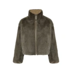Woman wearing Yves Salomon shearling fur coat – luxury outerwear at Luxury Shoes 
