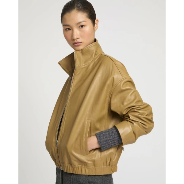 Woman wearing Yves Salomon shearling fur coat – luxury outerwear at Luxury Shoes 