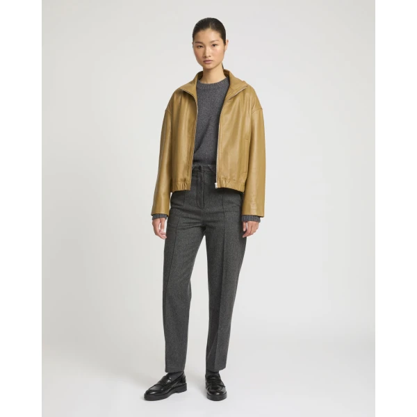 Woman wearing Yves Salomon shearling fur coat – luxury outerwear at Luxury Shoes 