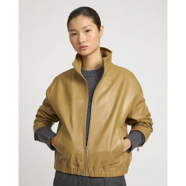 Woman wearing Yves Salomon shearling fur coat – luxury outerwear at Luxury Shoes 