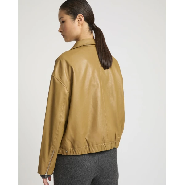 Woman wearing Yves Salomon shearling fur coat – luxury outerwear at Luxury Shoes 