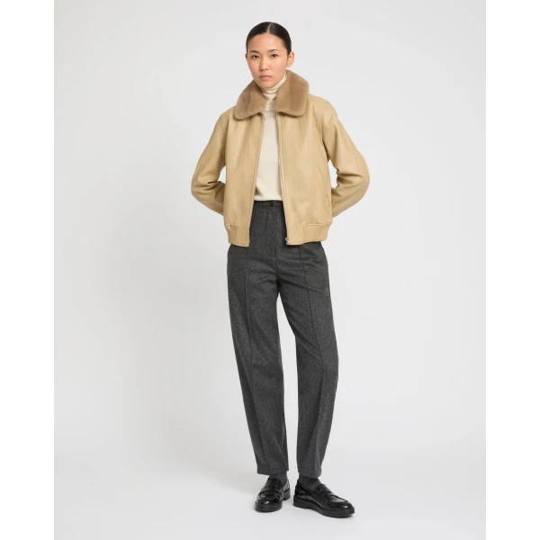 Woman wearing Yves Salomon shearling fur coat – luxury outerwear at Luxury Shoes 