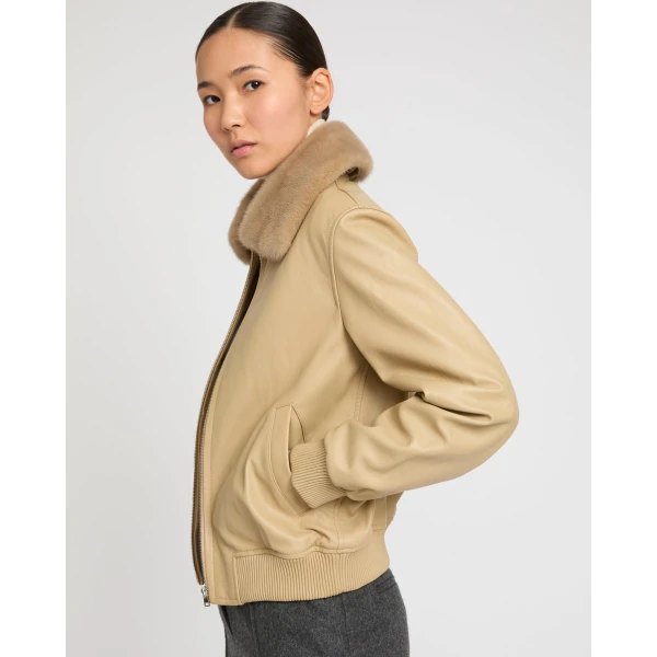 Woman wearing Yves Salomon shearling fur coat – luxury outerwear at Luxury Shoes 