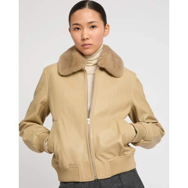 Woman wearing Yves Salomon shearling fur coat – luxury outerwear at Luxury Shoes 