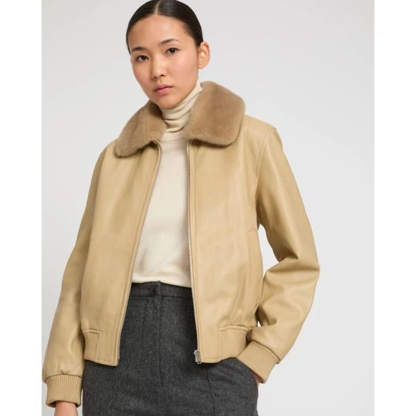 Woman wearing Yves Salomon shearling fur coat – luxury outerwear at Luxury Shoes 