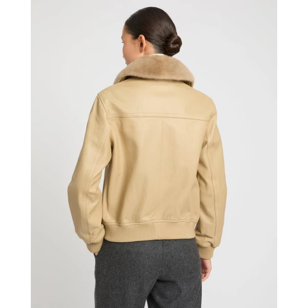 Woman wearing Yves Salomon shearling fur coat – luxury outerwear at Luxury Shoes 