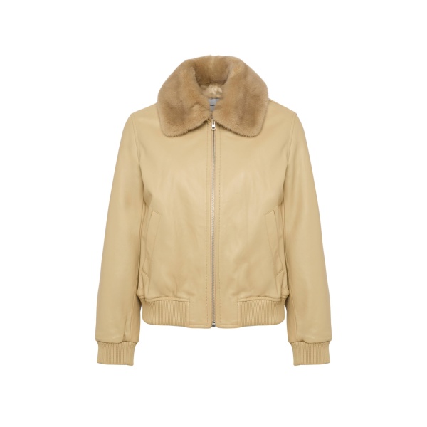 Woman wearing Yves Salomon shearling fur coat – luxury outerwear at Luxury Shoes 