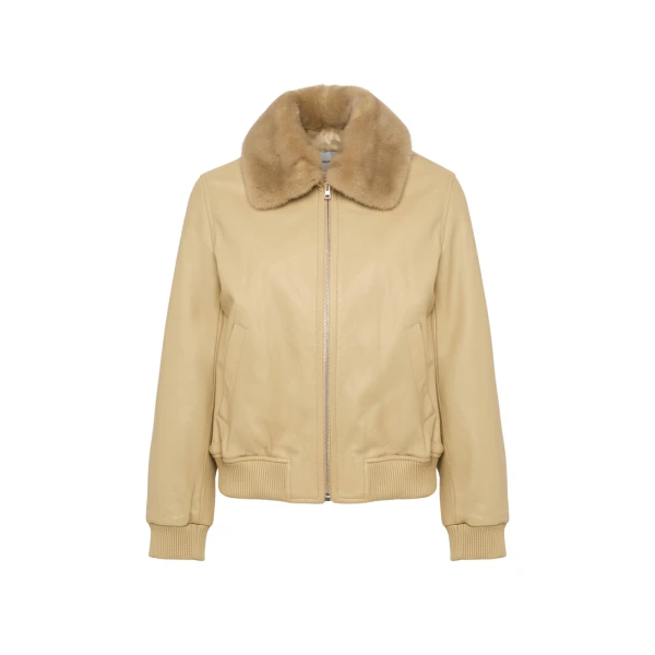 Woman wearing Yves Salomon shearling fur coat – luxury outerwear at Luxury Shoes 