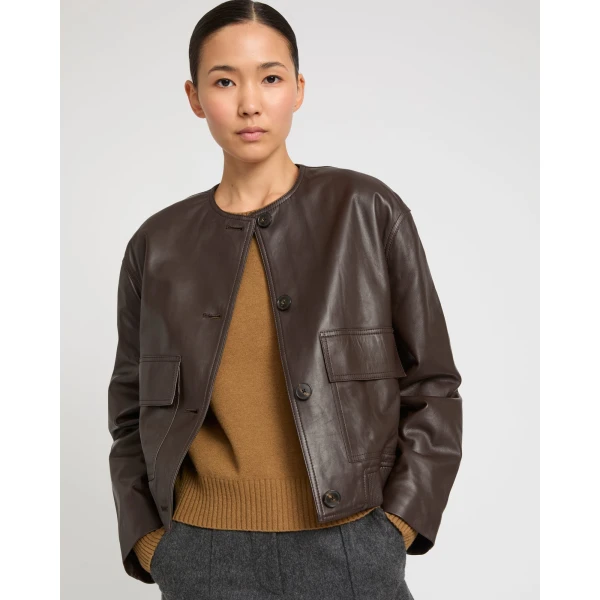 Woman wearing Yves Salomon shearling fur coat – luxury outerwear at Luxury Shoes 