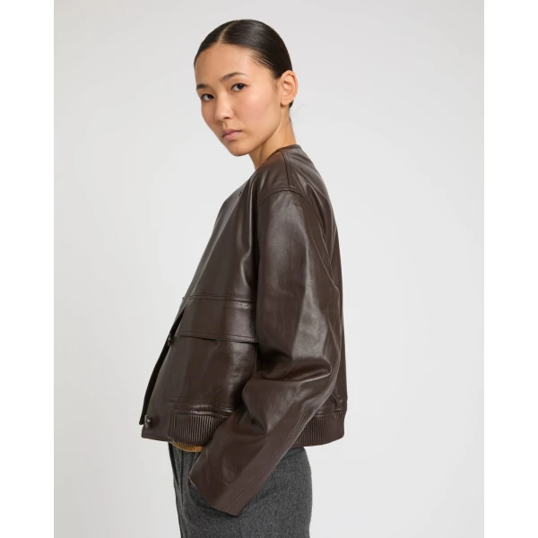 Woman wearing Yves Salomon shearling fur coat – luxury outerwear at Luxury Shoes 