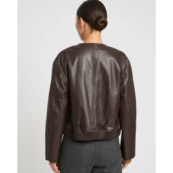 Woman wearing Yves Salomon shearling fur coat – luxury outerwear at Luxury Shoes 