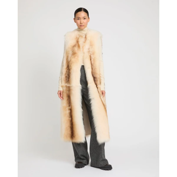 Woman wearing Yves Salomon shearling fur coat – luxury outerwear at Luxury Shoes 