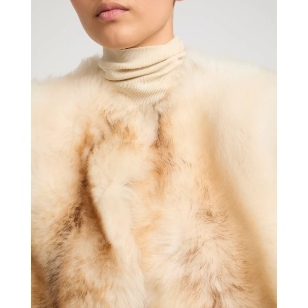 Woman wearing Yves Salomon shearling fur coat – luxury outerwear at Luxury Shoes 