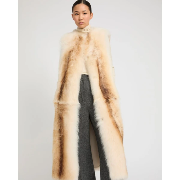 Woman wearing Yves Salomon shearling fur coat – luxury outerwear at Luxury Shoes 